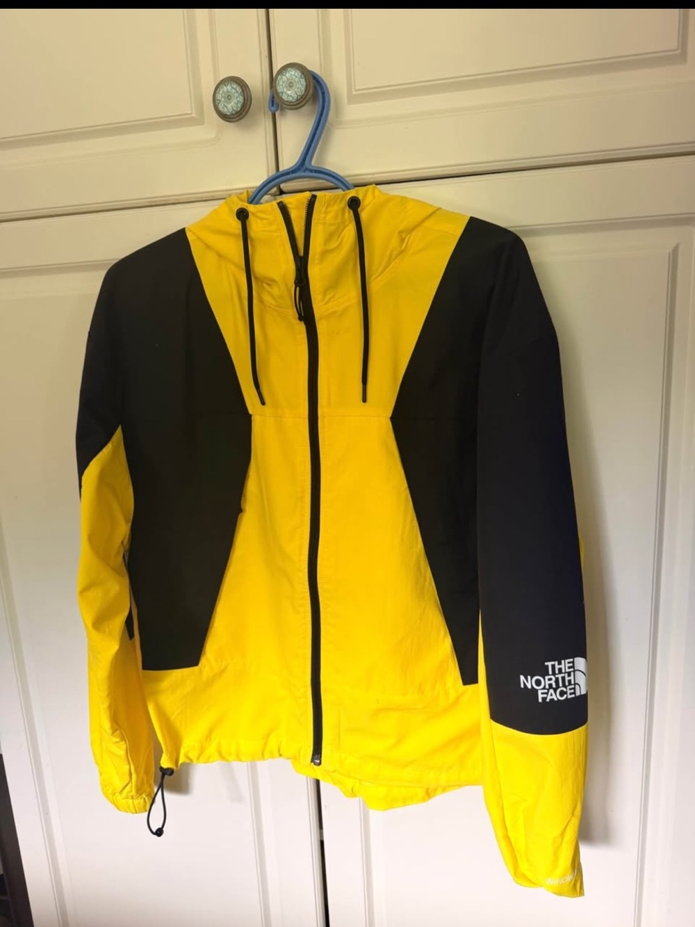 The North Face Yellow and Black Hooded Rain Jacket